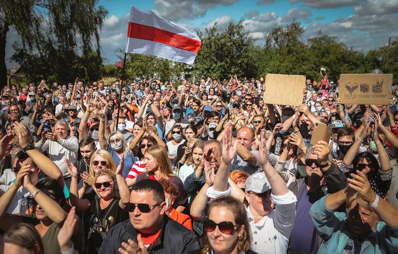 Belarusians attend a meeting in support of Svetlana Tikhanovskaya, candidate for the presidential elections, in Hlybokaje, Belarus, Friday, July 24, 2020. On Friday, 3,000 people turned out at an opposition gathering in Novopolotsk, north of the Belarusian capital. And in the town of Hlybokaje, which has a population of 18,000, more than 1,000 attended Tilkhanovskaya's campaign rally. The presidential election in Belarus is scheduled for August 9, 2020. (AP Photo)