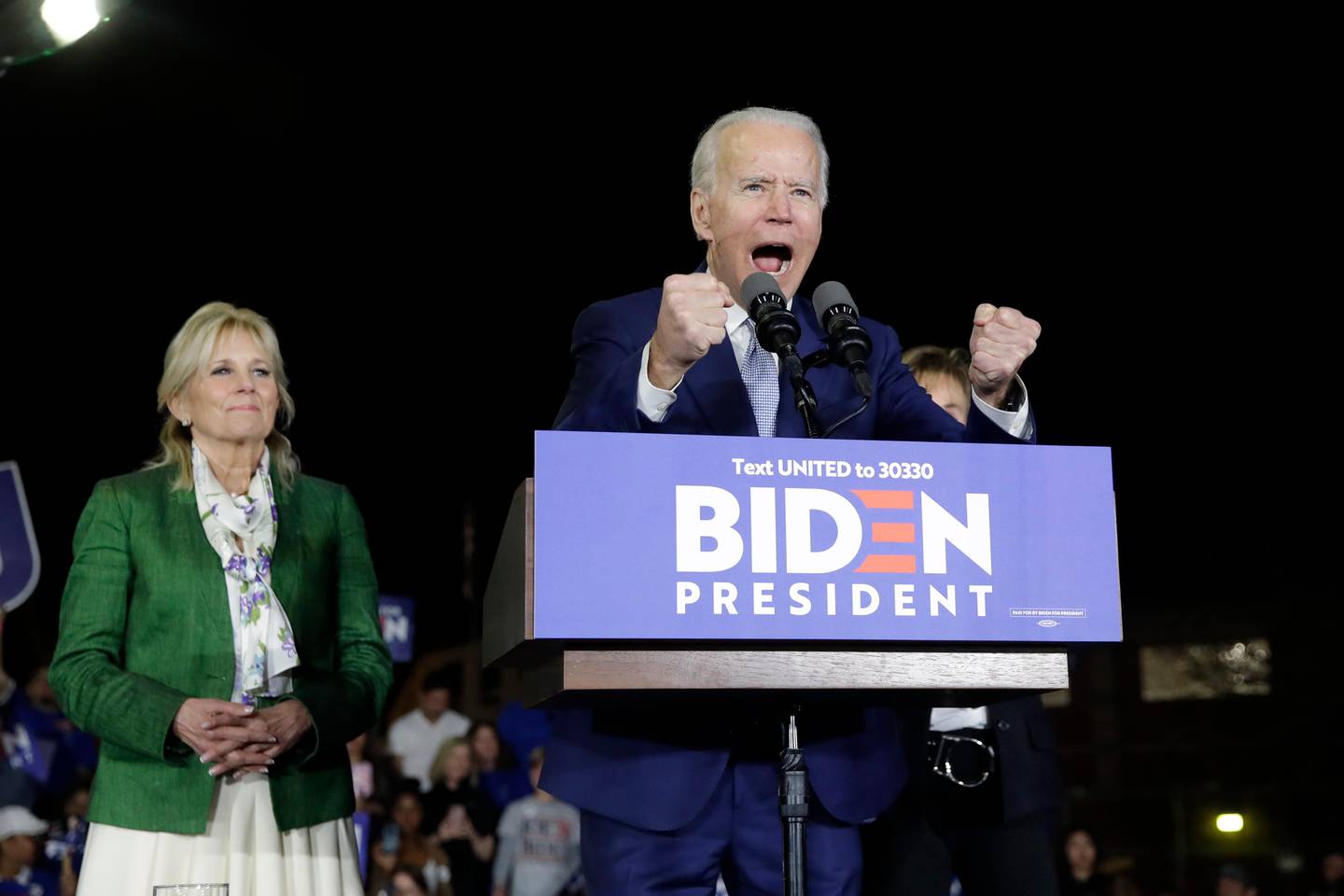 Democratic presidential candidate former Vice President Joe Biden, right, speaks next to his wife Jill during a primary election night rally Tuesday, March 3, 2020, in Los Angeles. (AP Photo/Marcio Jose Sanchez)