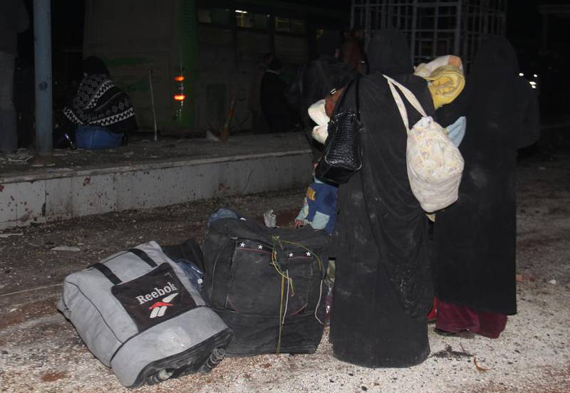 Bildet viser syrere med bagasje.