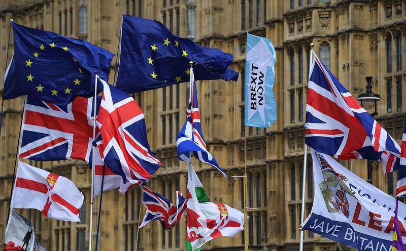 epa07956098 Flags fly outside parliament in London, Britain, 28 October 2019. EU leaders have agreed in principle to extend Brexit until 31 January 2020, meaning the UK will not leave 31 October as planned.  EPA/ANDY RAIN