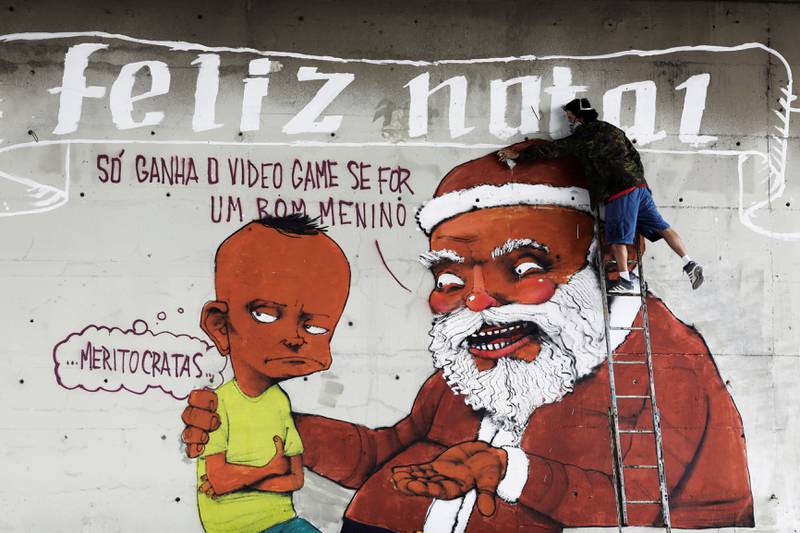Bildet viser en grafitti med en humoristisk versjon av julenissen og et misfornøyd barn. 