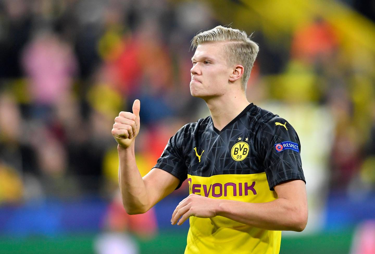Dortmund's Erling Braut Haaland gives thumbs up at the end of the Champions League round of 16 first leg soccer match between Borussia Dortmund and Paris Saint Germain in Dortmund, Germany, Tuesday, Feb. 18, 2020. (AP Photo/Martin Meissner)
